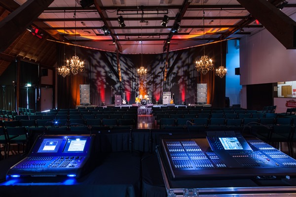 Image of stage with tech computers